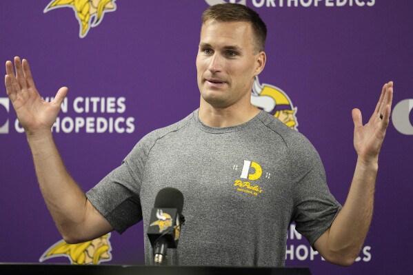 FILE - Minnesota Vikings quarterback Kirk Cousins speaks to the media during an NFL football press conference in Eagan, Minn., Wednesday, May 3, 2023. (AP Photo/Abbie Parr)