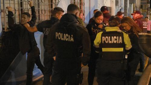 FILE - Police officer run a checkpoint set up in the nightclubs and bar zone of San Jose, Costa Rica, Jan 27, 2023. According to authorities, the Central American nation has reached its highest murder rate since the Organization of Judicial Investigation office has kept records. (AP Photo/Carlos Gonzalez, File)