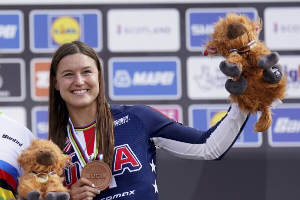 FILE - Third placed USA's Alise Willoughby with her bronze medal during day eleven of the 2023 UCI Cycling World Championships at the Glasgow BMX Centre, Glasgow, Scotland, Sunday Aug. 13, 2023. Willoughby was selected for her fourth Olympics and will lead the U.S. squad in BMX racing at the Paris Games in just over a month. (Tim Goode/PA via AP, File)