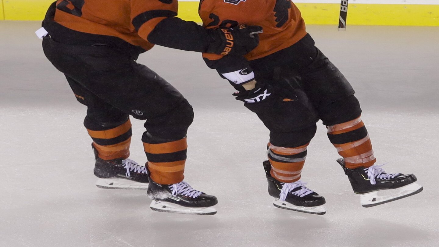 The Penguins and the Flyers' new mascot fired shots at each other