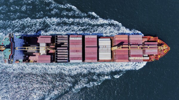 A container ship sails off from a container terminal in Qingdao in eastern China's Shandong province Sunday, April 6, 2025. (Chinatopix Via AP)