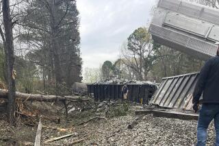 This photo provided by the Calhoun County Sheriff's Office shows a Norfolk Southern train after derailing on Thursday, March 9, 2023, in Calhoun County, Ala. The Alabama accident came on the same day the company’s CEO testified before Congress about the impact of a hazardous materials train derailment in Ohio. (Calhoun County Sheriff's Office via AP)