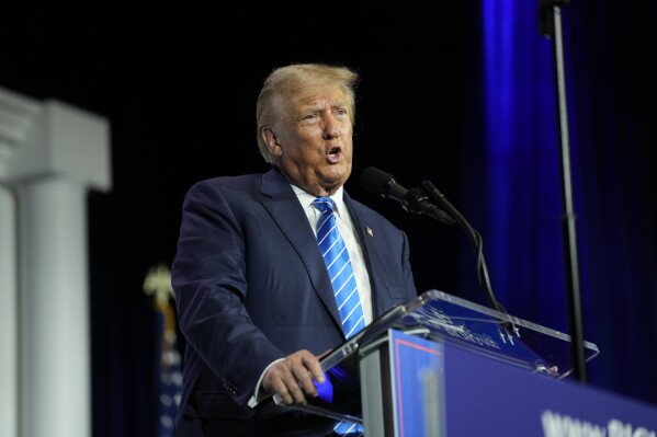 FILE - Republican presidential candidate and former President Donald Trump speaks at an annual leadership meeting of the Republican Jewish Coalition, Oct. 28, 2023, in Las Vegas. In a filing made Monday, Oct. 30, Trump is asking a court to prevent Michigan Secretary of State Jocelyn Benson from leaving his name off the 2024 primary ballot. (AP Photo/John Locher, File)