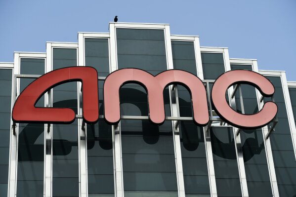 FILE - In this April 29, 2020 file photo, the AMC sign appears at AMC Burbank 16 movie theater complex in Burbank, Calif. AMC Theaters, the nation’s largest chain, is pushing back its plans to begin reopening theaters by two weeks. The company said Monday that it would open approximately 450 U.S. locations on July 30 and the remaining 150 the following week. (AP Photo/Chris Pizzello, File)