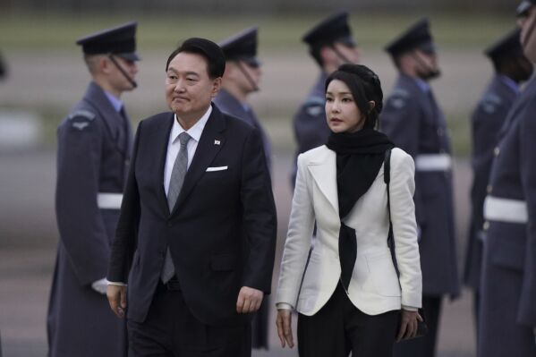 South Korea's President Yoon Suk Yeol and first lady Kim Keon Hee, arrive at Stansted Airport, Essex, England, Monday Nov. 20, 2023, for the start of his state visit to the UK. (Joe Giddens/PA via AP)