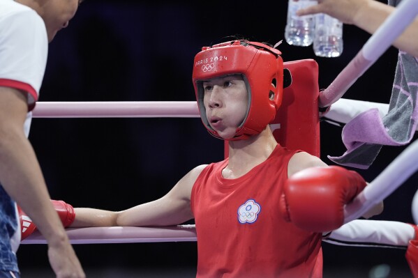 Taiwan's Lin Yu-ting rests between rounds against Uzbekistan's Sitora Turdibekova in their women's 57 kg preliminary boxing match at the 2024 Summer Olympics, Friday, Aug. 2, 2024, in Paris, France. (AP Photo/Ariana Cubillos)