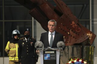 FILE - In this Friday, Sept. 11, 2020 file photo, NATO Secretary General Jens Stoltenberg speaks during a ceremony marking the 19th anniversary of the Sept. 11 attacks, at NATO headquarters in Brussels. NATO Secretary-General Jens Stoltenberg warned Tuesday, Nov. 17, 2020 that the military organization could pay a heavy price for leaving Afghanistan too early, after a U.S. official said President Donald Trump is expected to withdraw a significant number of American troops from the conflict-ravaged country in coming weeks. (AP Photo/Francisco Seco, Pool, File)