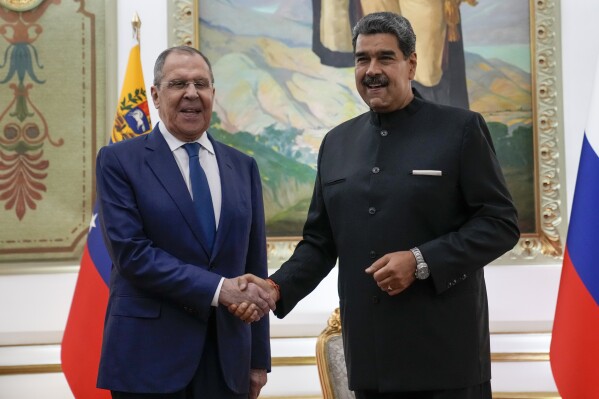 Venezuelan President Nicolas Maduro, right, meets with Russia's Foreign Minister Sergey Lavrov at Miraflores presidential palace in Caracas, Venezuela, Tuesday, Feb. 20, 2024. (AP Photo/Ariana Cubillos)