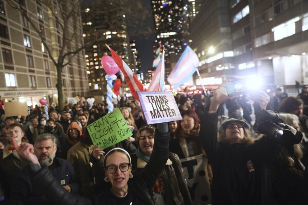 The crowd marches during a rally demanding that NYU Langone commit to providing gender-affirming care for transgender youth following an executive order by President Donald Trump aimed at cutting federal funding, Monday, Feb. 3, 2025, in New York. (AP Photo/Heather Khalifa)