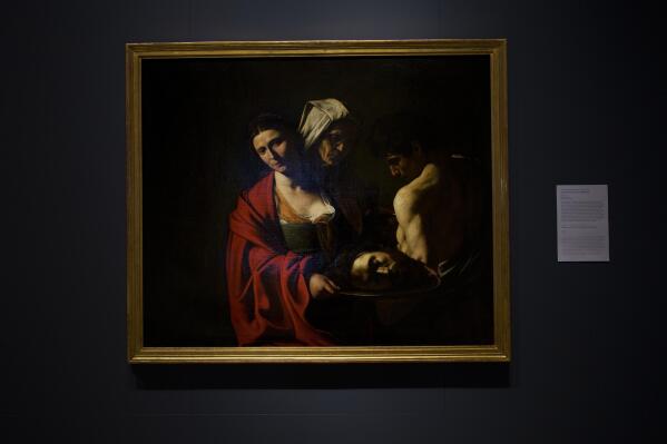 A painting called "Salome with the Head of John the Baptist", by Caravaggio is displayed at the Royal Collections Gallery in Madrid, Spain, Friday, May. 19, 2023. Spain is set to unveil what is touted as one of Europe’s cultural highlights of the year with the opening in Madrid of The Royal Collections Gallery next month. (AP Photo/Manu Fernandez)