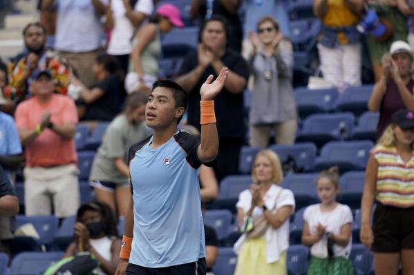 Brandon Nakashima, of the United States, reacts after beating John Isner, of the United States, during the first round of the US Open tennis championships, Monday, Aug. 30, 2021, in New York. (AP Photo/Seth Wenig)