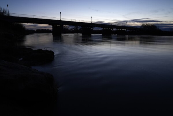 Water flows down the Green River, a tributary of the Colorado River, Wednesday, Jan. 24, 2024, in Green River, Utah. (AP Photo/Brittany Peterson)