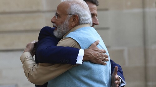 French President Emmanuel Macron hugs Indian Prime Minister Narendra Modi before a working dinner, Thursday, July 13, 2023 at the Elysee Palace, in Paris. Narendra Modi is on a two-day visit and will attend Bastille Day parade with French President Emmanuel Macron on Friday. (AP Photo/Aurelien Morissard)