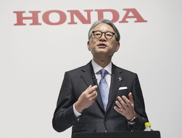 Honda President Toshihiro Mibe speaks during a joint press conference with Nissan Chief Executive Makoto Uchida in Tokyo, Friday, March 15, 2024. Nissan and Honda announced Friday that they will work together in developing electric vehicles and auto intelligence technology, sectors where Japanese automakers have fallen behind. (Kyodo News via AP)