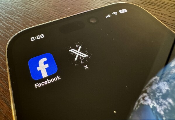 App logos for Facebook, left, and X, formerly known as Twitter, are seen on a mobile phone in Los Angeles, Saturday, March 16, 2024. (AP Photo/Paula Ulichney)