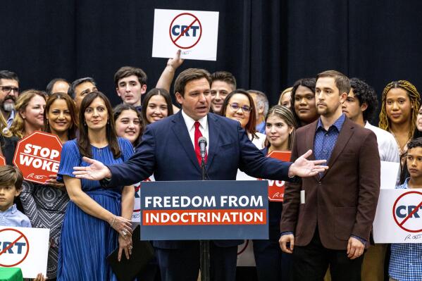 FILE - Florida Gov. Ron DeSantis addresses the crowd before publicly signing HB7, "individual freedom," also dubbed the "Stop Woke" bill during a news conference at Mater Academy Charter Middle/High School in Hialeah Gardens, Fla., on Friday, April 22, 2022. As Republicans and Democrats fight for control of Congress this fall, a growing collection of conservative political action groups is targeting its efforts closer to home: at local school boards. DeSantis endorsed a slate of school board candidates, putting his weight behind conservatives who share his opposition to lessons on sexuality and what he deems critical race theory. (Daniel A. Varela/Miami Herald via AP, File)