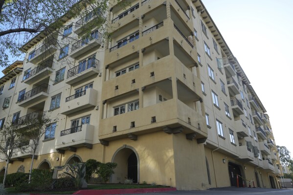 The exterior of the Montecito Apartments complex is pictured in Los Angeles, Wednesday, April 10, 2024. A woman who authorities say fatally stabbed her partner inside their home in the complex Monday, then threw her two children from a moving SUV onto the freeway, killing her infant daughter, appeared to be agitated by the impending eclipse. (AP Photo/Damian Dovarganes)