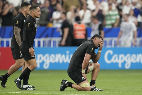New Zealand's Ardie Savea, right, and New Zealand's Aaron Smith react after the Rugby World Cup Pool A match between France and New Zealand at the Stade de France in Saint-Denis, north of Paris, Friday, Sept. 8, 2023. France won the match 27-13. (AP Photo/Christophe Ena)