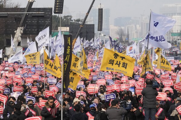 Doctors stage a rally against the government's medical policy in Seoul, South Korea, Sunday, March 3, 2024. Thousands of senior doctors rallied in Seoul on Sunday to express their support for junior doctors who have been on strike for nearly two weeks over a government plan to sharply increase the number of medical school admissions.(AP Photo/Ahn Young-joon)