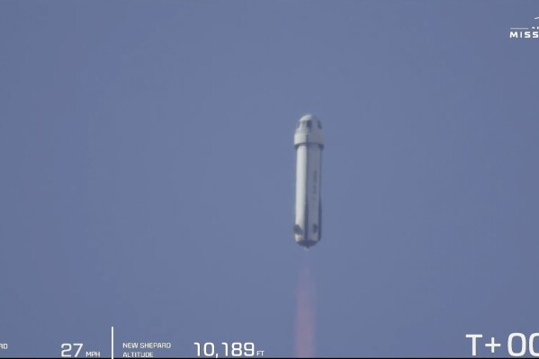 This image provided by Blue Origin shows New Shepard seconds after takeoff in West Texas, Tuesday, Feb. 4, 2025. (Blue Origin via AP)