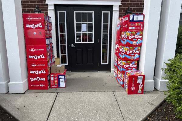 This image provided by Holly LaFavers shows boxes of Dum-Dum lollipops outside of Holly LaFavers's home Monday, May 5, 2025, in Lexington, Ky. (Holly LaFavers via AP)