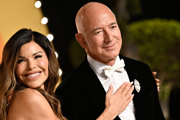 Lauren Sanchez and Jeff Bezos arrives at the Vanity Fair Oscar Party at the Wallis Annenberg Center for the Performing Arts in Beverly Hills, Calif., March 2, 2025. (Photo by Evan Agostini/Invision/AP File)