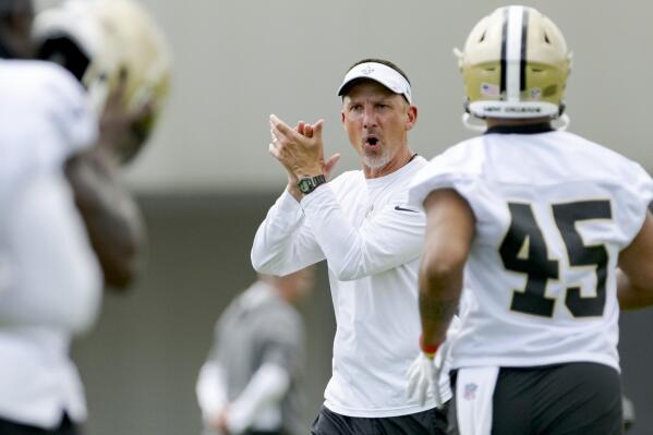 FILE - New Orleans Saints head coach Dennis Allen claps for his players during an NFL football practice in Metairie, La., Wednesday, June 15, 2022. Allen enters training camp with a roster that has been fortified at several key spots since former long-time coach Sean Payton retired after last season. (AP Photo/Matthew Hinton, File)