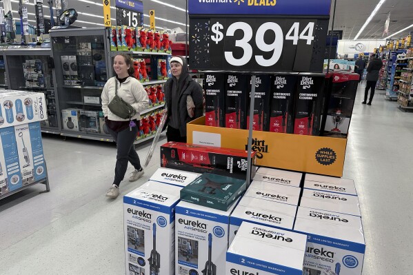 People shop for Black Friday deals at a Walmart store in Rochester, New York on Friday, November 29, 2024. (AP Photo/Ted Shaffrey, File)