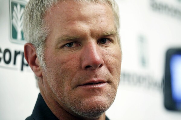 FILE - Former NFL quarterback Brett Favre speaks with reporters prior to his induction to the Mississippi Hall of Fame, Aug. 1, 2015, in Jackson, Miss. Favre will answer questions under oath about the misspending of federal welfare money in Mississippi, where public money intended to help some of the nation’s poorest people was used to fund pet projects he and other well-connected people supported. A notice of deposition filed Monday, Oct. 2, 2023, by attorneys for Mississippi's Department of Human Services shows Favre will give sworn testimony on Oct. 26. (AP Photo/Rogelio V. Solis, File)