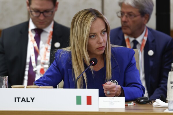 Italian Prime Minister Giorgia Meloni attends Partnership for Global Infrastructure and Investment event on the day of the G20 summit in New Delhi, India, Sept. 9, 2023. (AP Photo/Evelyn Hockstein, Pool)