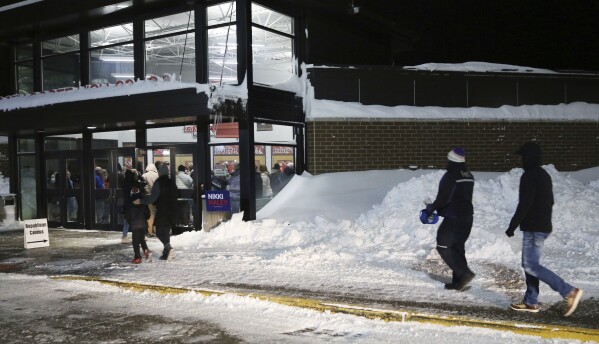 Scott County caucusgoers head into North Scott Excessive Faculty, Monday, Jan. 15, 2024, in the future of the 2024 Iowa Republican caucuses in Eldridge, Iowa. (Roy Dabner/Quad City Times via AP)