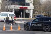 A police vehicle is parked outside Saint Alphonsus Regional Medical Center in Boise, Idaho, on Wednesday, March 20, 2024. Three Idaho corrections officers were shot as a suspect staged a brazen attack to break Skylar Meade, a prison inmate out of the Boise hospital overnight. Two of the officers were shot by the suspect early Wednesday. The third was shot and wounded by a police officer when police mistook the correctional officer for the suspect. (Sarah A. Miller/Idaho Statesman via AP)