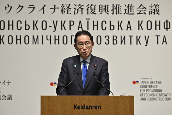 Japanese Prime Minister Fumio Kishida delivers a speech during the Japan-Ukraine Conference for Promotion of Economic Growth and Reconstruction at Keidanren Kaikan building in Tokyo, Monday, Feb. 19, 2024. (Kazuhiro Nogi/Pool Photo via AP)
