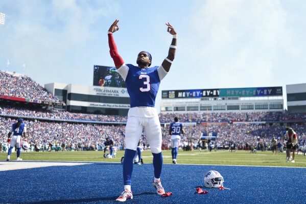 Buffalo Bills safety Damar Hamlin (3) raises his arms while warming up prior to an NFL football game against the Miami Dolphins, Sunday, Oct. 1, 2023, in Orchard Park, N.Y. (AP Photo/Adrian Kraus)