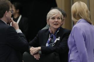 U.S. Energy Secretary Jennifer Granholm, center, has a small talk with her counterparts before a plenary session in the G-7 ministers' meeting on climate, energy and environment in Sapporo, northern Japan, Saturday, April 15, 2023. (AP Photo/Hiro Komae)