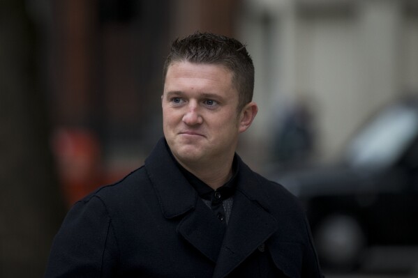 Tommy Robinson, the former leader of the far-right EDL "English Defence League" group arrives for an appearance at Westminster Magistrates Court in London, Oct. 16, 2013. (AP Photo/Matt Dunham, File)