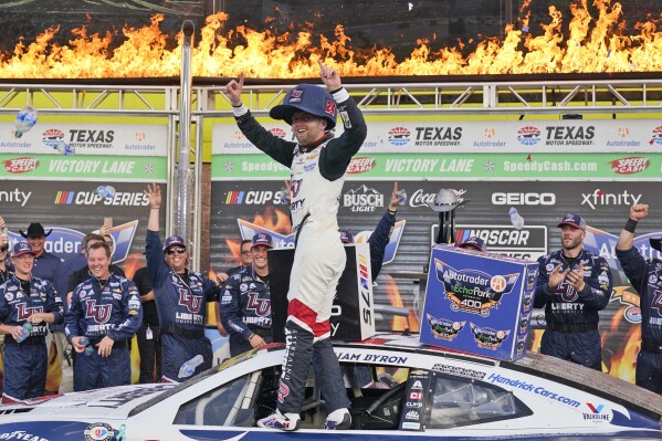 William Byron (24) celebrates winning the NASCAR Cup Series auto race at Texas Motor Speedway in Fort Worth, Texas, Sunday, Sept. 24, 2023. (AP Photo/LM Otero)