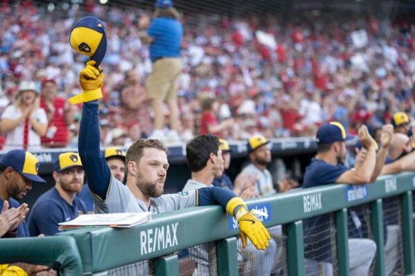 Milwaukee Brewers' Rhys Hoskins reacts to a tribute video and waves to the crowd during the second inning of a baseball game against the Philadelphia Phillies, Monday, June 3, 2024, in Philadelphia. (AP Photo/Chris Szagola)