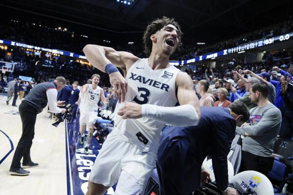 Xavier's Colby Jones (3) reacts after defeating Connecticut in an NCAA college basketball game, Saturday, Dec. 31, 2022, in Cincinnati. (AP Photo/Jeff Dean)