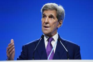 FILE - John Kerry, United States Special Presidential Envoy for Climate, speaks at an event about the "Global Methane Pledge" at the COP26 U.N. Climate Summit, Tuesday, Nov. 2, 2021, in Glasgow, Scotland. A new project trumpeted by U.S. President Joe Biden in which companies underpin development of low-carbon technologies through their buying power amounts to a “big transformation,” U.S. climate envoy John Kerry said Thursday, Nov. 4, 2021 hoping to leverage the private sector to do more in the fight against global warming.  (AP Photo/Evan Vucci, File)