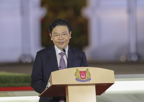 In this photo released by Singapore's Ministry of Communications and Information, Singapore's new Prime Minister Lawrence Wong makes a speech after being sworn in at the Istana in Singapore, Wednesday, May 15, 2024. Wong was sworn in Wednesday as the nation's fourth prime minister in a carefully planned political succession designed to ensure continuity and stability in the Asian financial hub. (Ministry of Communications and Information via AP)