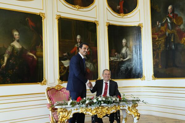 Czech Republic's President Millos Zeman, right, welcomes Qatari Emir Sheikh Tamim Bin Hamad Al-Thani at the Prague Castle in Prague, Czech Republic, Wednesday, Oct. 5, 2022. (AP Photo/Petr David Josek)