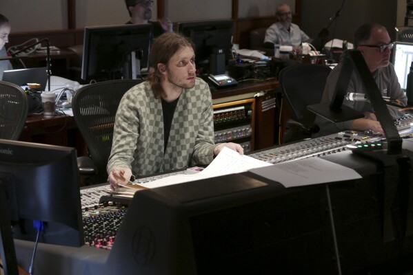 This image released by Universal Pictures shows composer Ludwig Goransson on the set of "Oppenheimer." (Melinda Sue Gordon/Universal Pictures via AP)