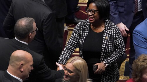 FILE - Missouri Sen. Karla May, D-St. Louis, shakes hands with a fellow lawmaker as she enters the House chamber to hear the State of the State address, Jan. 18, 2023, in Jefferson City, Mo. May is running for U.S. Senate in Missouri, she announced Tuesday, July 11, in her hometown. The St. Louis Democrat is vying for the Democratic nomination against St. Louis County Prosecuting Attorney Wesley Bell and Marine veteran Lucas Kunce. (AP Photo/Jeff Roberson, File)