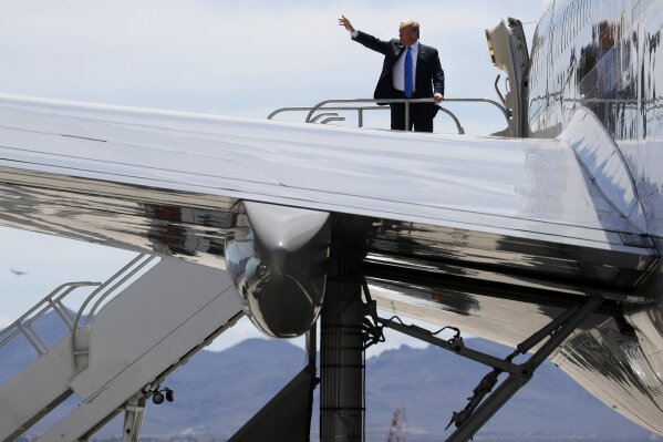 
              President Donald Trump waves from the top of the stairs of Air Force One as he leaves Las Vegas after speaking at the Republican Jewish Coalition's annual leadership meeting, Saturday April 6, 2019, en route to Washington. (AP Photo/Jacquelyn Martin)
            