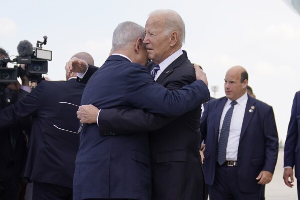 President Joe Biden is greeted by Israeli Prime Minister Benjamin Netanyahu after arriving at Ben Gurion International Airport, Wednesday, Oct. 18, 2023, in Tel Aviv. (AP Photo/Evan Vucci)