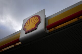 FILE - A sign at a Shell petrol station in London, Thursday, Feb. 2, 2023. Shell has effectively abandoned a plan to cut oil production by 1-2% per year until the end of the decade and instead maintain it at current levels, in a move that risks angering climate activists. Ahead of an investor update in New York on Wednesday, June 14, 2023, Europe's largest energy company argued that it had already met the target it had set itself in 2021 through asset sales. (AP Photo/Kirsty Wigglesworth, File)