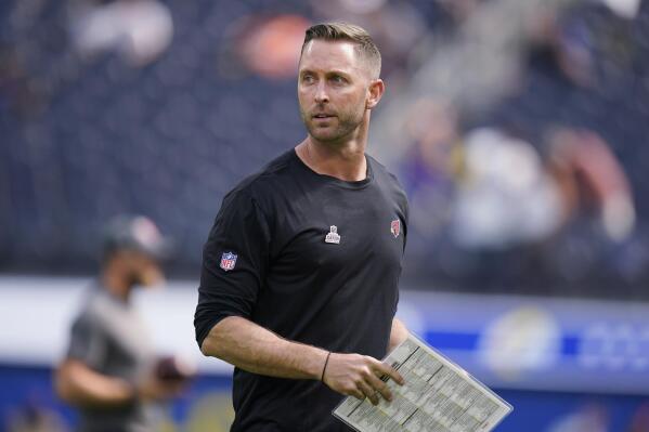 FILE - In this Oct. 3, 2021, file photo, Arizona Cardinals coach Kliff Kingsbury walks on the field before the team's NFL football game against the Los Angeles Rams in Inglewood, Calif. Kingsbury and an assistant coach and a player will miss the Cardinals' game Sunday at Cleveland after testing positive for COVID-19. (AP Photo/Jae C. Hong, File)
