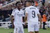 Real Madrid's Vinicius Junior, left, and Kylian Mbappe celebrate after a goal during the La Liga soccer match between Barcelona and Real Madrid in Barcelona, Spain, Sunday, May 11, 2025. AP Photo/Joan Monfort)