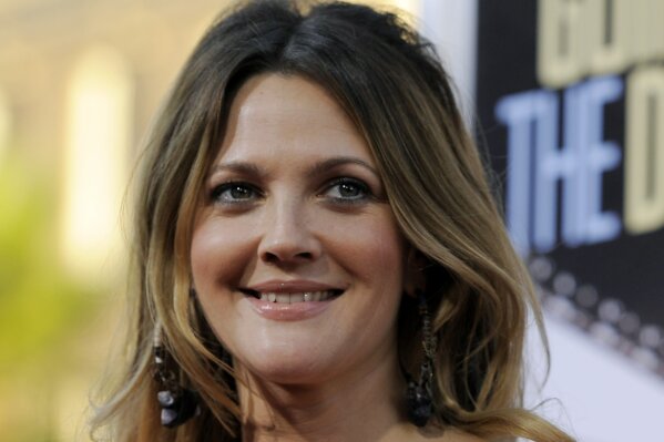 
              FILE - In this Monday, Aug. 23, 2010, file photo, Drew Barrymore, a cast member in "Going the Distance," arrives at the premiere of the film in Los Angeles. EgyptAir is standing by a writer for its in-flight magazine who penned a bizarre article purportedly based on an interview with American actress Drew Barrymore. (AP Photo/Chris Pizzello, File)
            